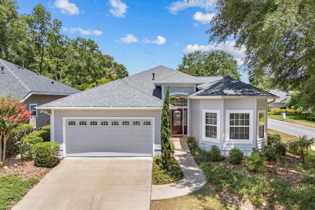 923 SW 85th Way, Gainesville, FL 32607 - single story home featuring a garage, driveway, and a shingled roof