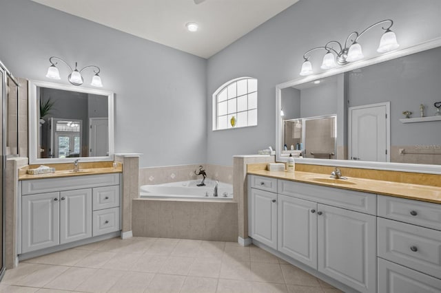 923 SW 85th Way, Gainesville, FL 32607 - bathroom with a shower stall, two vanities, a garden tub, and tile patterned flooring