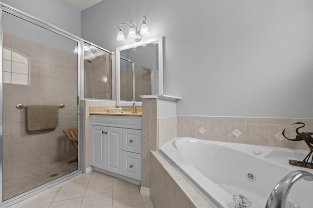 923 SW 85th Way, Gainesville, FL 32607 - bathroom with vanity, a shower stall, a tub with jets, and tile patterned floors