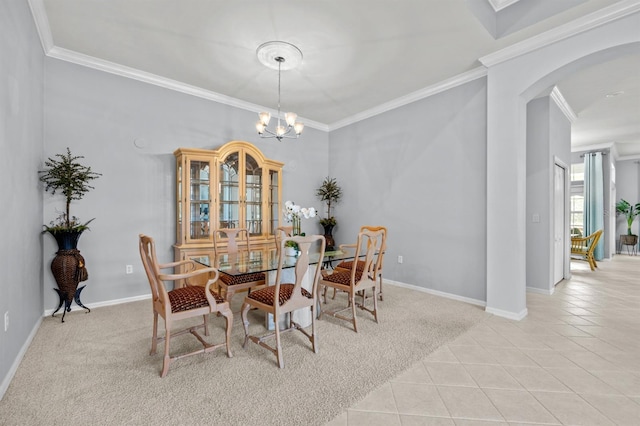 923 SW 85th Way, Gainesville, FL 32607 - dining space featuring arched walkways, ornamental molding, light tile patterned floors, a chandelier, and baseboards