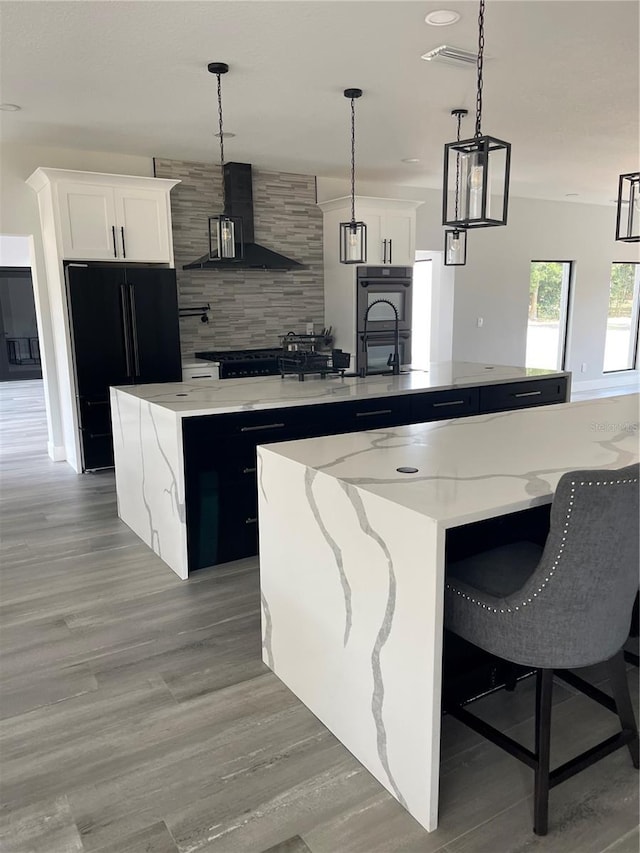 2518 Sunset Ln, Lutz, FL 33559 - kitchen featuring a large island, black appliances, range hood, backsplash, and pendant lighting