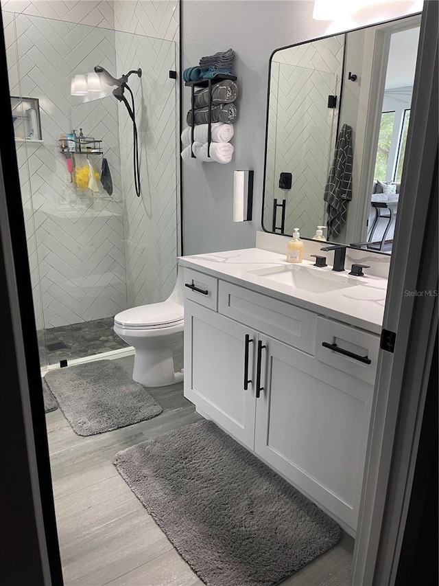 2518 Sunset Ln, Lutz, FL 33559 - full bath with vanity, a shower stall, and wood finished floors