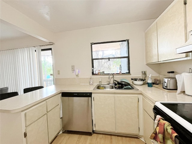 2811 SW Archer Rd Unit T164, Gainesville, FL 32608 - kitchen with stainless steel dishwasher, a peninsula, light countertops, a sink, and healthy amount of natural light