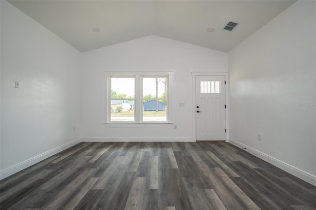 5670 NE 140th Ct, Williston, FL 32696 - foyer featuring lofted ceiling, dark wood-type flooring, and baseboards