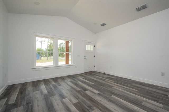 5670 NE 140th Ct, Williston, FL 32696 - empty room with lofted ceiling, dark wood finished floors, and baseboards
