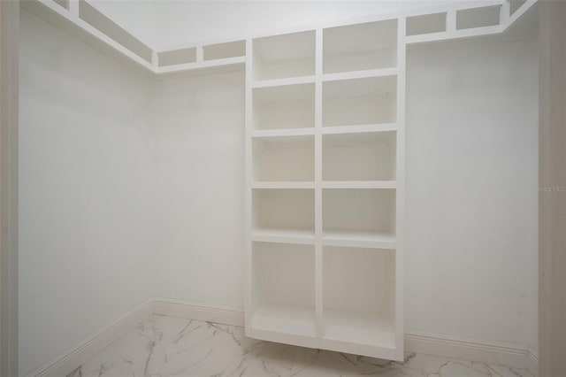 5670 NE 140th Ct, Williston, FL 32696 - spacious closet featuring marble look tiles
