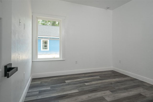 5670 NE 140th Ct, Williston, FL 32696 - empty room with dark wood-style floors and baseboards