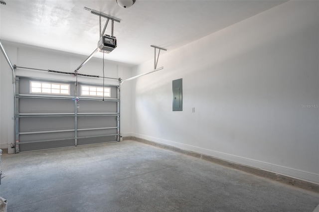 5670 NE 140th Ct, Williston, FL 32696 - garage featuring electric panel, a garage door opener, and baseboards