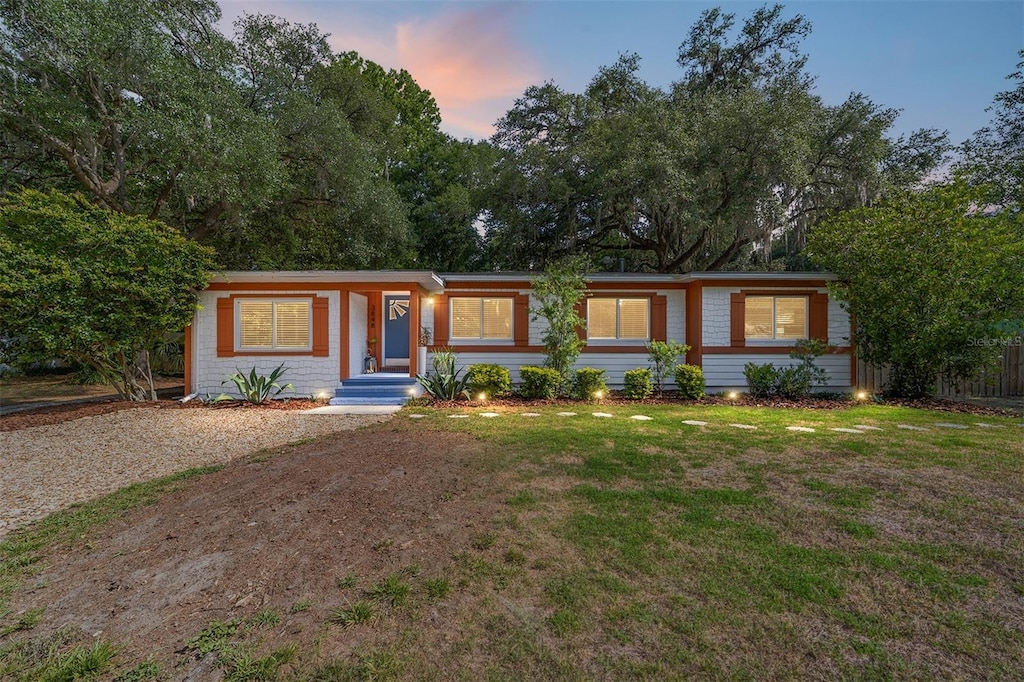 3848 SW 1st Ave, Gainesville, FL 32607 - ranch-style home with a lawn