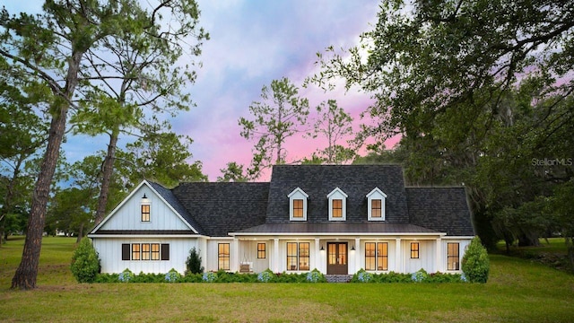 6206 NW 105th Ave, Alachua, FL 32615 - modern farmhouse featuring a lawn, french doors, and board and batten siding