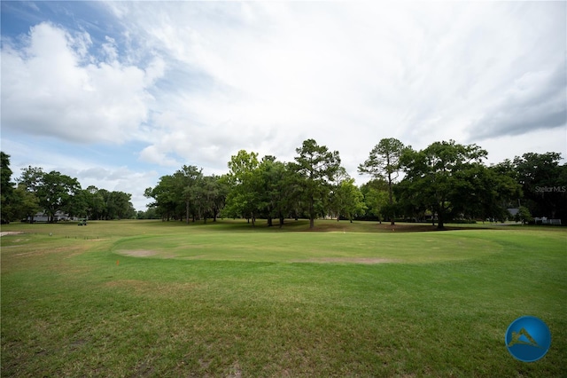 6206 NW 105th Ave, Alachua, FL 32615 - view of home's community featuring a yard, view of wooded area, and view of golf course