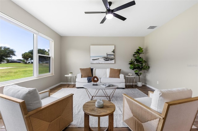 1044 SW 159th St, Ocala, FL 34473 - living room with wood finished floors, baseboards, and ceiling fan