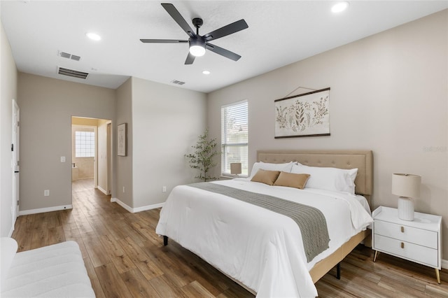 1044 SW 159th St, Ocala, FL 34473 - bedroom featuring wood finished floors, baseboards, recessed lighting, and a ceiling fan