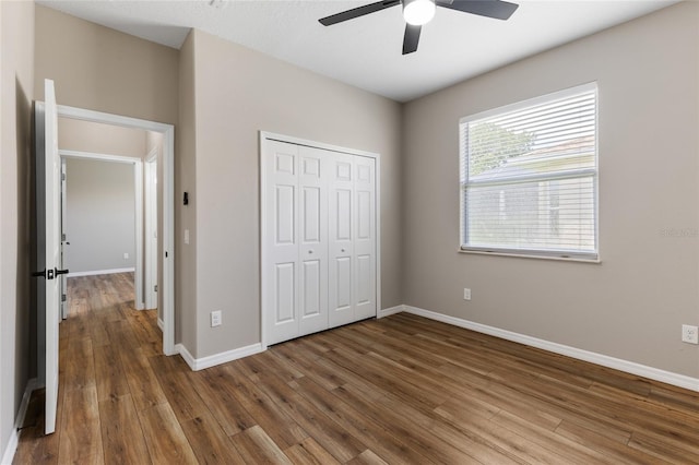 1044 SW 159th St, Ocala, FL 34473 - unfurnished bedroom featuring wood finished floors, a closet, and baseboards