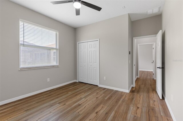 1044 SW 159th St, Ocala, FL 34473 - unfurnished bedroom featuring light wood finished floors, a closet, and baseboards