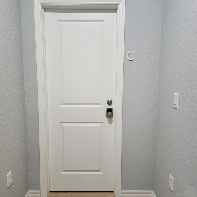 5479 S Biscayne Dr, North Port, FL 34287 - detailed view of baseboards and a textured wall