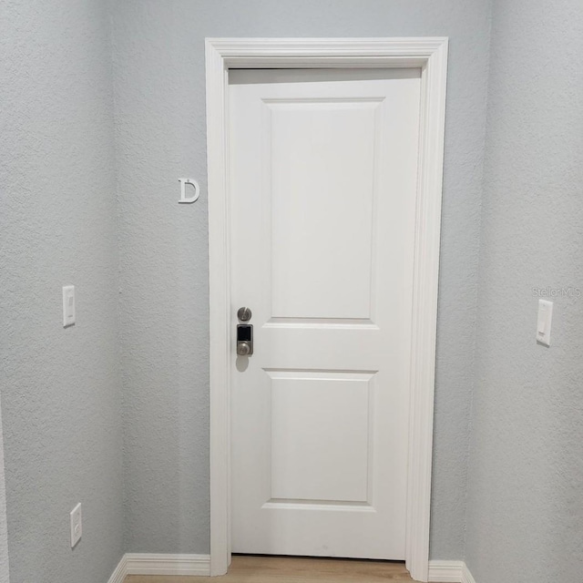 5479 S Biscayne Dr, North Port, FL 34287 - doorway to outside featuring light wood-style floors and baseboards