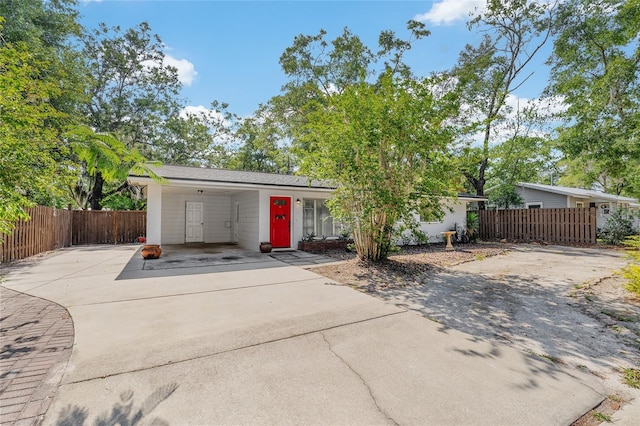 3861 NW 19th St, Gainesville, FL 32605 - mid-century home featuring driveway and a carport