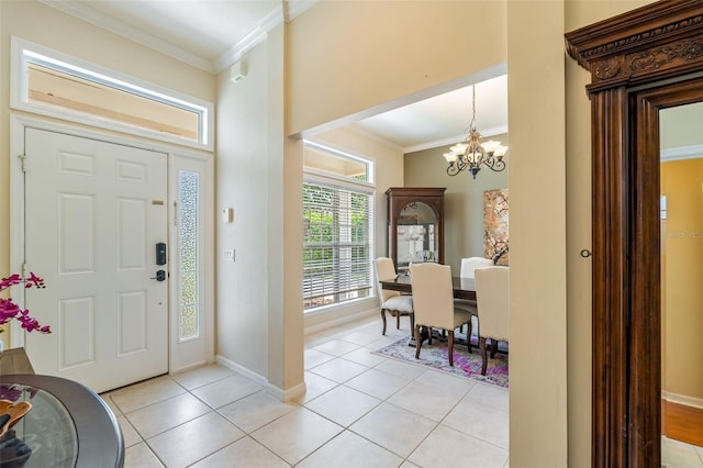 9263 SW 29th Ave, Gainesville, FL 32608 - foyer entrance featuring ornamental molding, a chandelier, light tile patterned flooring, and baseboards