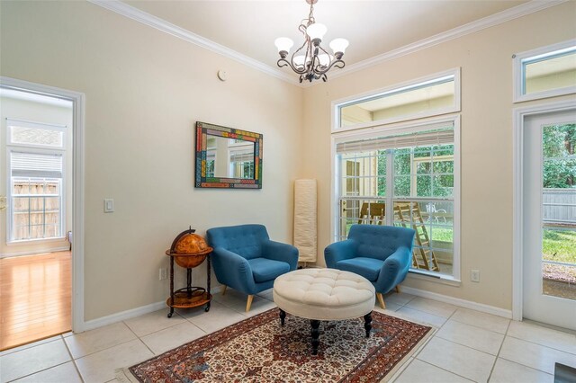 9263 SW 29th Ave, Gainesville, FL 32608 - living area featuring light tile patterned flooring, ornamental molding, a chandelier, and baseboards