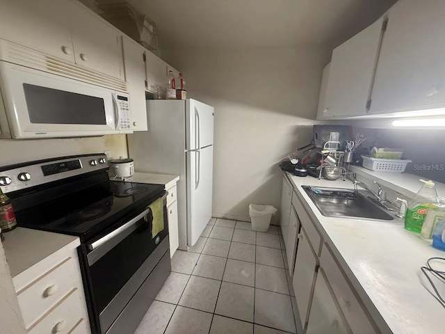 3800 SW 20th Ave Unit 611, Gainesville, FL 32607 - kitchen featuring white appliances, a sink, and light countertops
