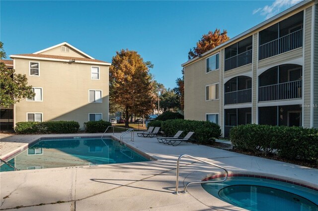 3800 SW 20th Ave Unit 611, Gainesville, FL 32607 - community pool featuring a patio and a hot tub