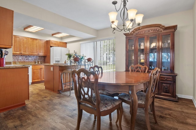 401 NW 39th Rd Unit 401C, Gainesville, FL 32607 - dining space featuring a chandelier and wood finished floors