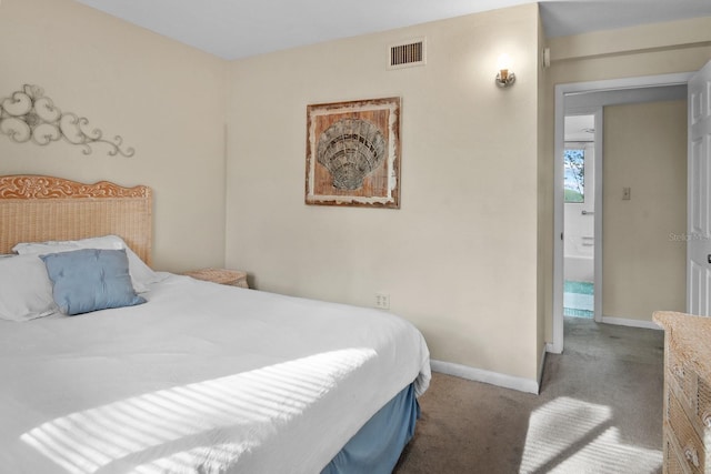 401 NW 39th Rd Unit 401C, Gainesville, FL 32607 - bedroom with baseboards and carpet floors