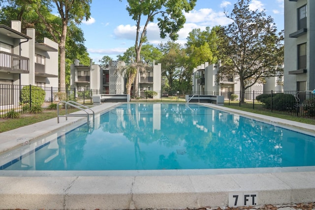 401 NW 39th Rd Unit 401C, Gainesville, FL 32607 - community pool with a residential view