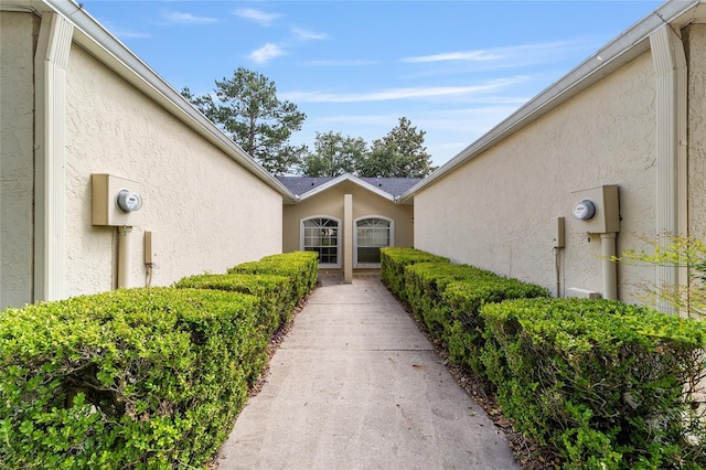 6245 NW 106th Pl Unit 6245, Alachua, FL 32615 - view of exterior entry featuring stucco siding