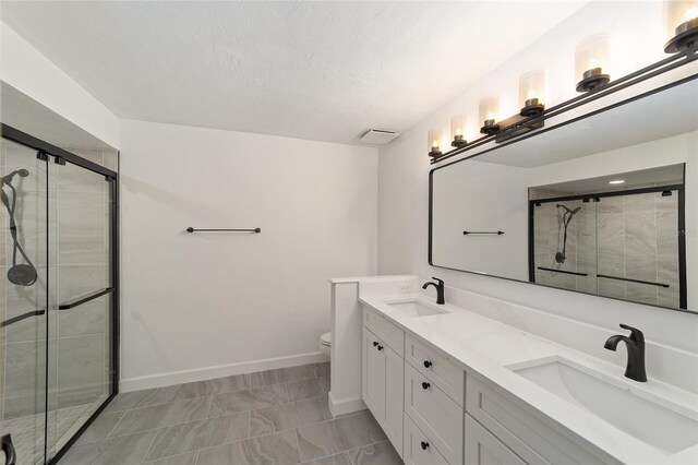 6245 NW 106th Pl Unit 6245, Alachua, FL 32615 - bathroom featuring double vanity, a shower stall, and toilet
