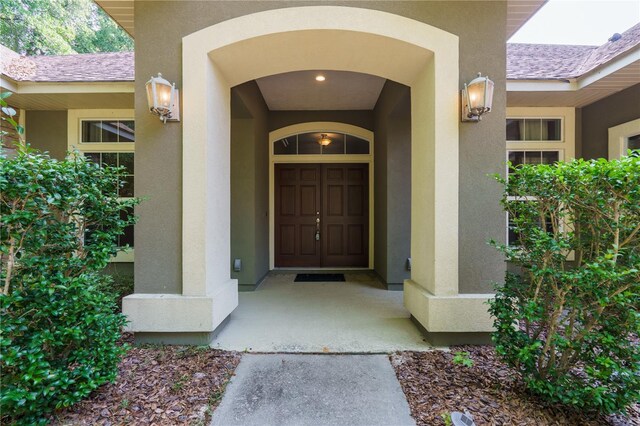 5119 NW 57th St, Gainesville, FL 32653 - view of exterior entry featuring stucco siding