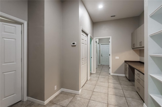 5119 NW 57th St, Gainesville, FL 32653 - laundry room featuring light tile patterned flooring and baseboards