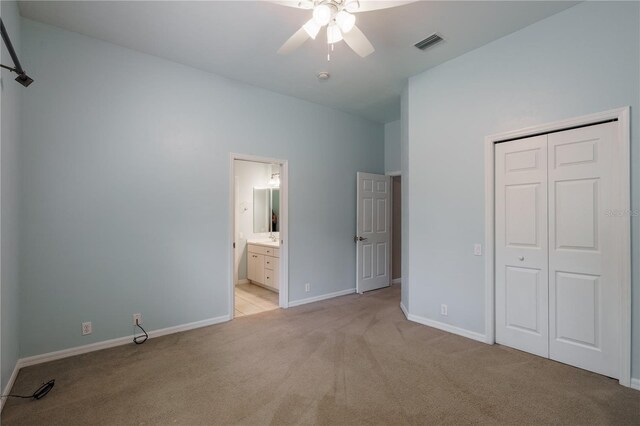 5119 NW 57th St, Gainesville, FL 32653 - unfurnished bedroom featuring light colored carpet, a closet, baseboards, ceiling fan, and ensuite bath