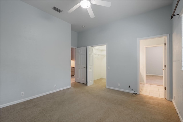 5119 NW 57th St, Gainesville, FL 32653 - unfurnished bedroom with light colored carpet, baseboards, a spacious closet, and a closet