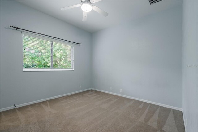 5119 NW 57th St, Gainesville, FL 32653 - unfurnished room featuring light carpet, baseboards, and ceiling fan