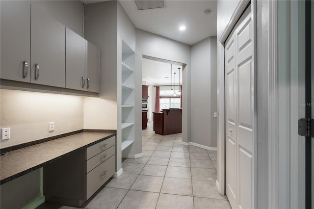 5119 NW 57th St, Gainesville, FL 32653 - hallway with baseboards, light tile patterned flooring, and recessed lighting