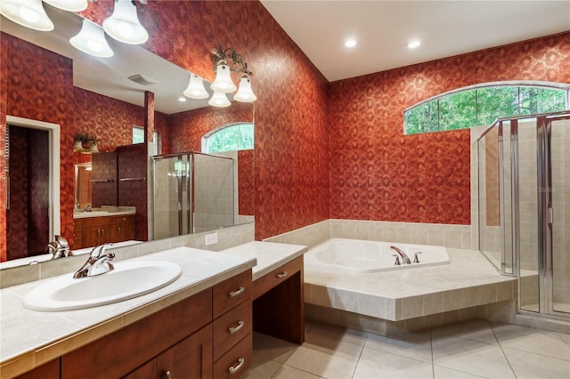 5119 NW 57th St, Gainesville, FL 32653 - bathroom featuring tile patterned flooring, vanity, a garden tub, a shower stall, and wallpapered walls