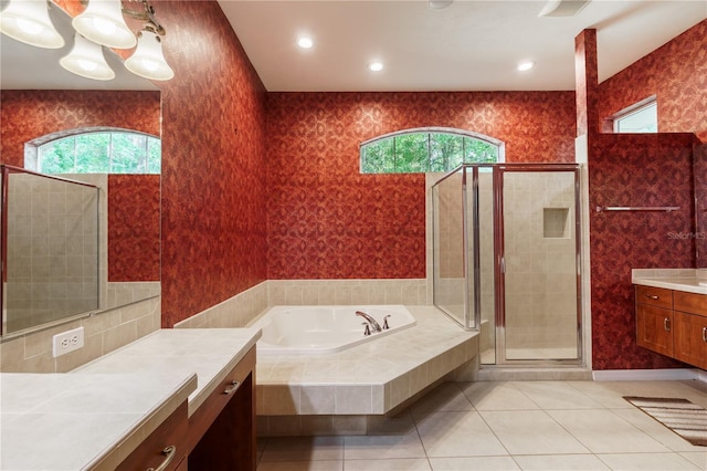5119 NW 57th St, Gainesville, FL 32653 - bathroom with vanity, a bath, a stall shower, and tile patterned floors