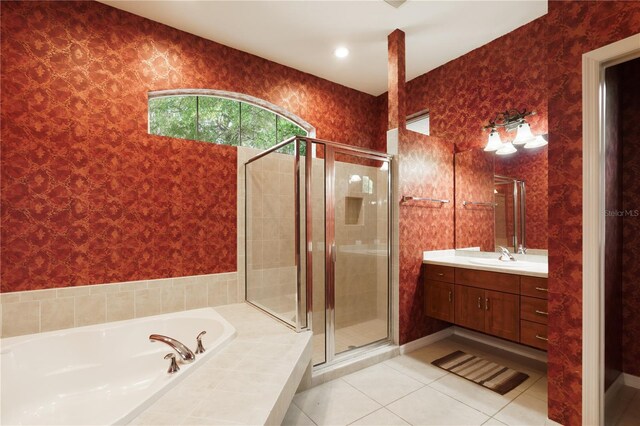 5119 NW 57th St, Gainesville, FL 32653 - bathroom featuring vanity, a stall shower, tile patterned flooring, and a garden tub
