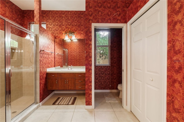 5119 NW 57th St, Gainesville, FL 32653 - bathroom featuring a stall shower, toilet, vanity, wallpapered walls, and tile patterned flooring