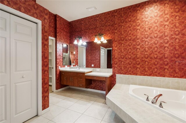 5119 NW 57th St, Gainesville, FL 32653 - bathroom featuring a closet, vanity, a bath, tile patterned flooring, and wallpapered walls