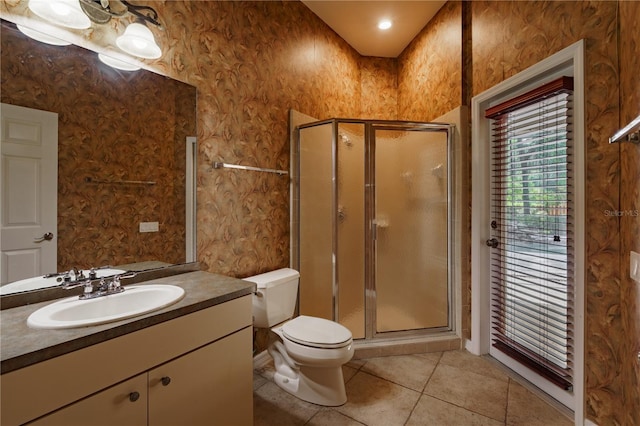 5119 NW 57th St, Gainesville, FL 32653 - full bath with a stall shower, vanity, toilet, and tile patterned flooring