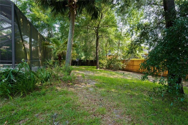 5119 NW 57th St, Gainesville, FL 32653 - view of yard with a lanai