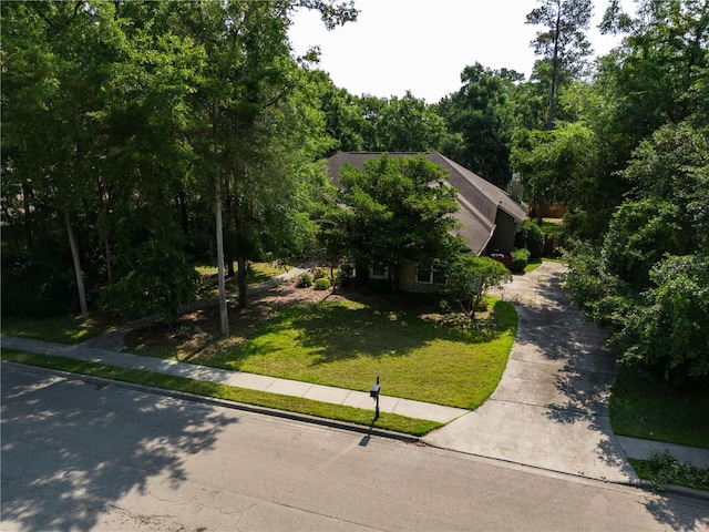 5119 NW 57th St, Gainesville, FL 32653 - obstructed view of property with a front lawn