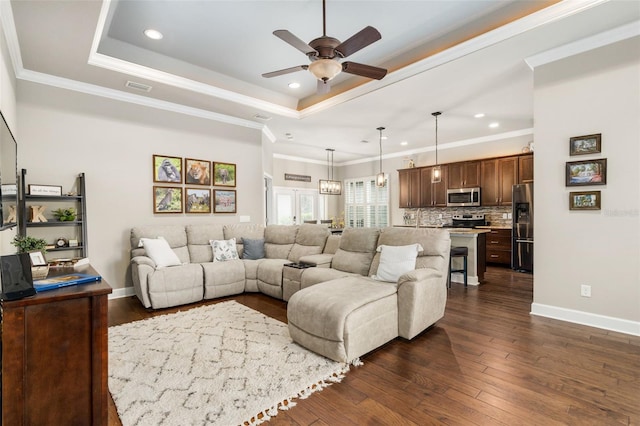 2898 SW 117th Way, Gainesville, FL 32608 - living area featuring a ceiling fan, a tray ceiling, dark wood-style flooring, recessed lighting, and baseboards