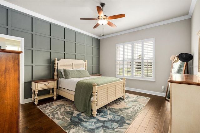 2898 SW 117th Way, Gainesville, FL 32608 - bedroom featuring ornamental molding, a decorative wall, baseboards, dark wood finished floors, and a ceiling fan
