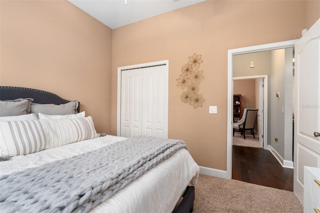 2898 SW 117th Way, Gainesville, FL 32608 - bedroom with dark colored carpet, a closet, and baseboards