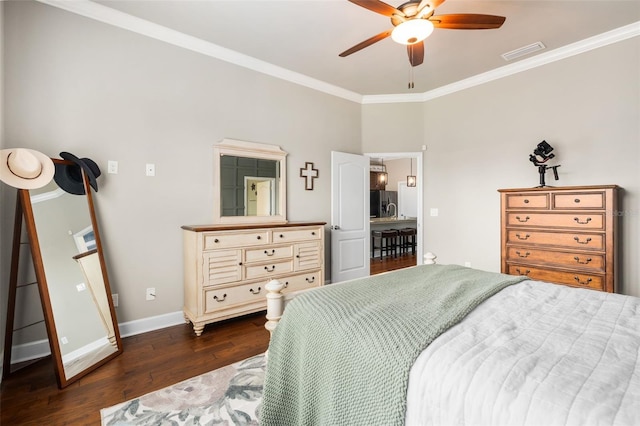 2898 SW 117th Way, Gainesville, FL 32608 - bedroom with dark wood-style floors, ornamental molding, stainless steel fridge, baseboards, and a ceiling fan