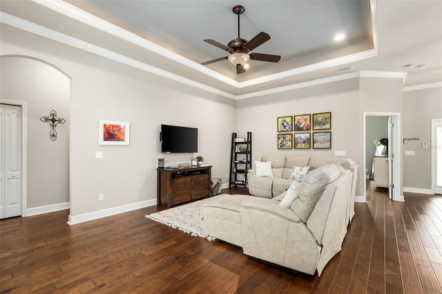 2898 SW 117th Way, Gainesville, FL 32608 - living area with a raised ceiling, a ceiling fan, crown molding, dark wood finished floors, and baseboards